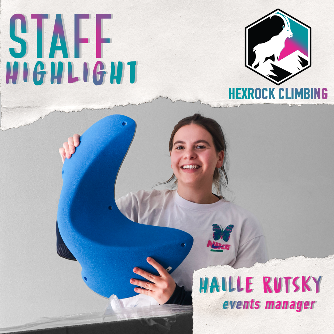 A woman smiling while holding a blue climbing hold in front of a gray background. She is wearing a white NIKE t-shirt with a butterfly logo. The image features text indicating it's a staff highlight at Hexrock Climbing, with her name as Haille Rutsky, events manager.