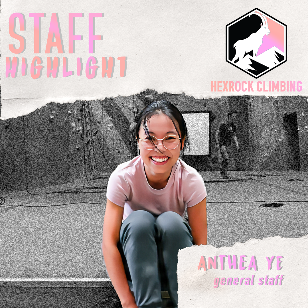 A woman wearing glasses and a pink shirt smiling while sitting on the floor of an indoor climbing gym. The background shows climbing walls and a person in climbing gear. The image features text indicating staff highlights and a logo of a mountain goat with the words Hexrock Climbing.