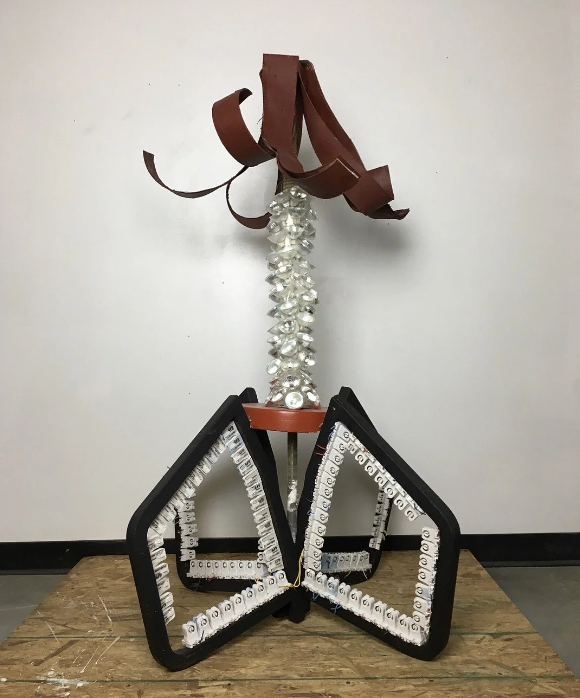 Unlit Lamp, repurposed materials, plaster, wooden chairs, electrical pieces, cardboard, rope, fan, stand, lights, 2018