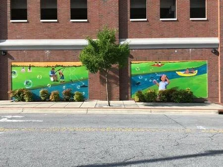 A Great Place To Be Outside, exterior paint, 5th Street Parking Deck, Greenville, NC, 2022. Collaboration with Rakia Jackson.