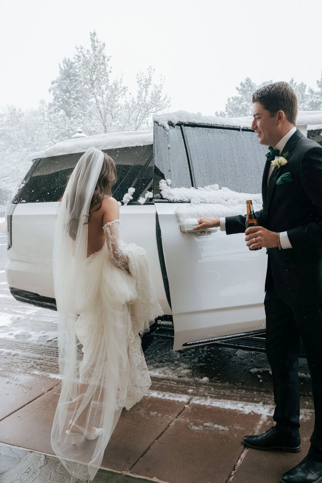 Bride and groom at The Broadmoor entering car to head to ceremony
