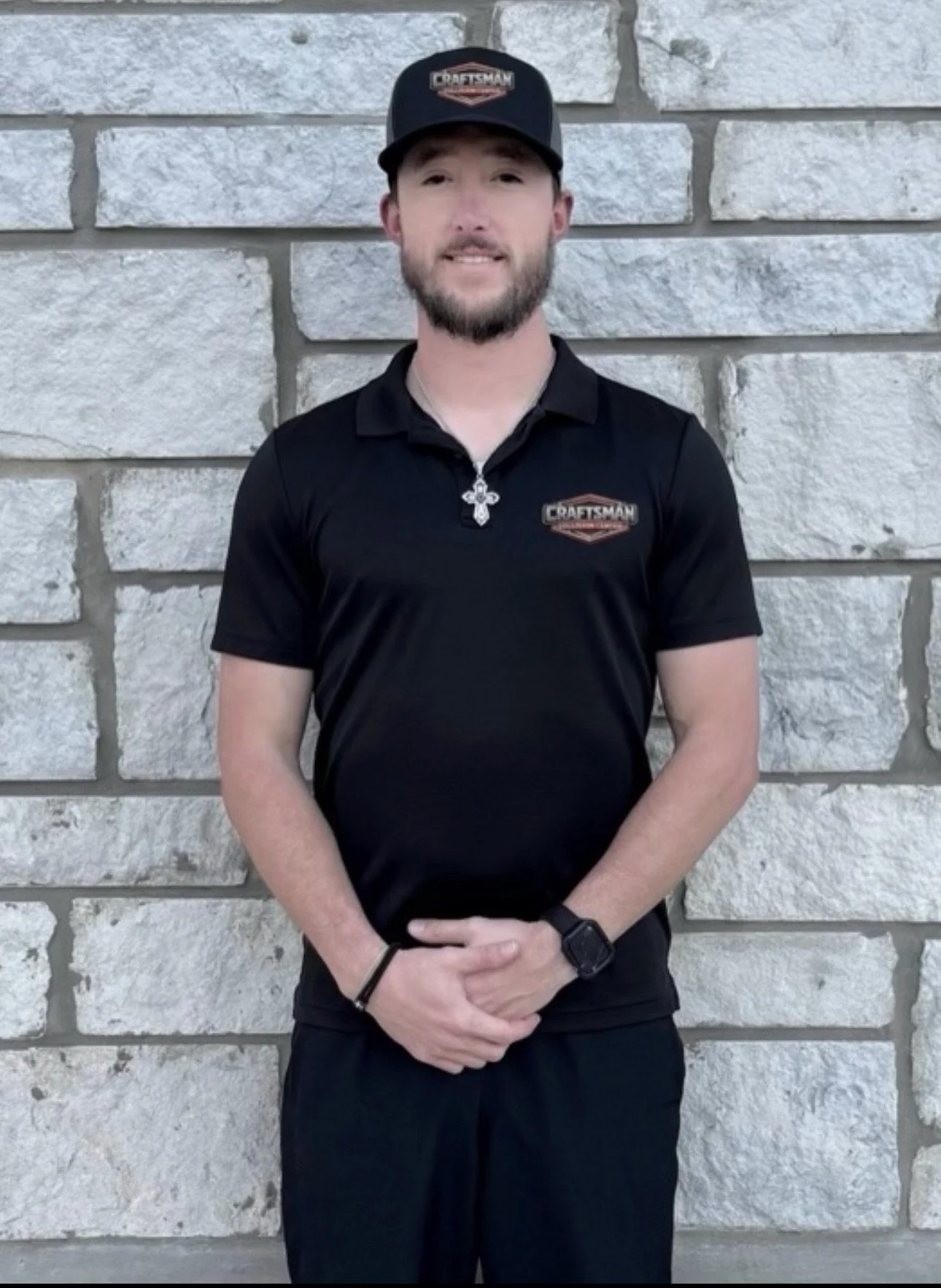 A metal adjustable wrench on a plain light-colored surface.
