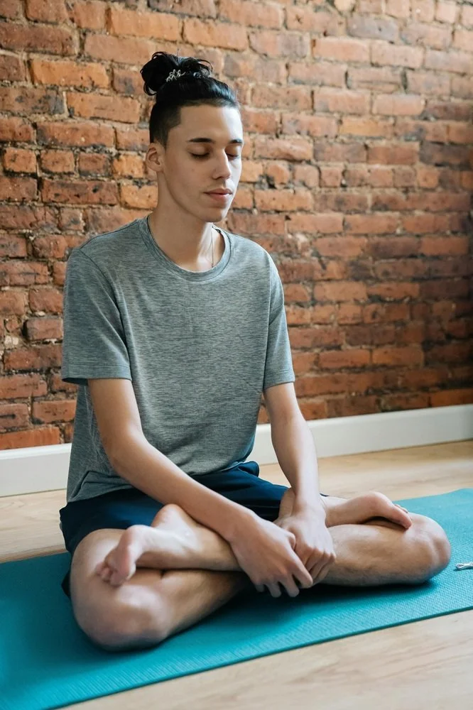 Teen boy doing yoga