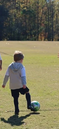 Boy playing soccer