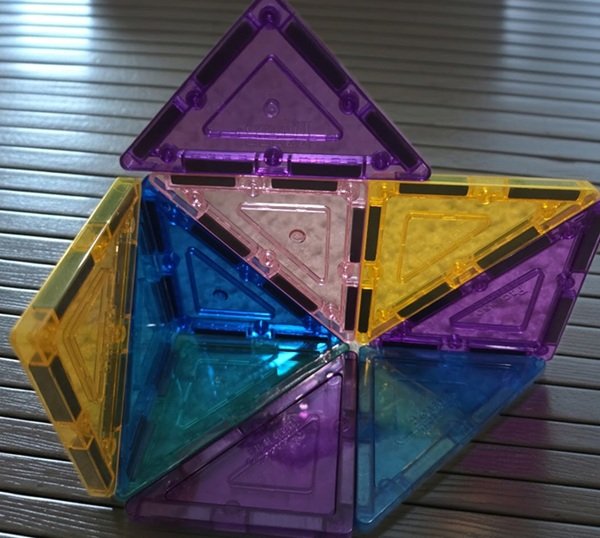 Blue, yellow, pink, and purple magnetic tiles