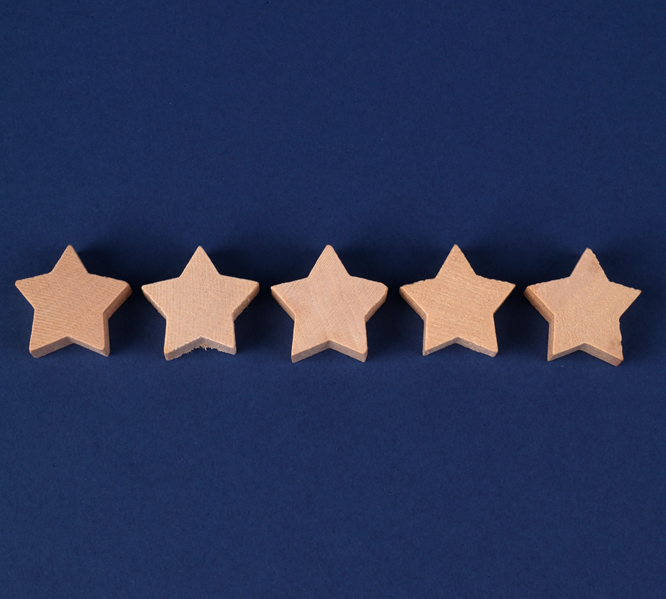 5 wooden stars on a navy blue background