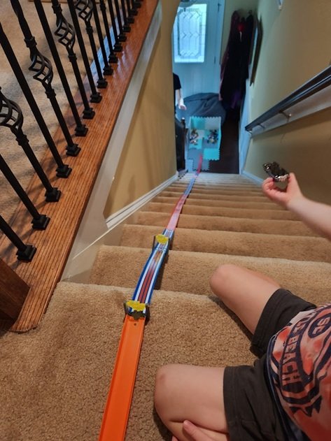 Choosing a car to race down stair track