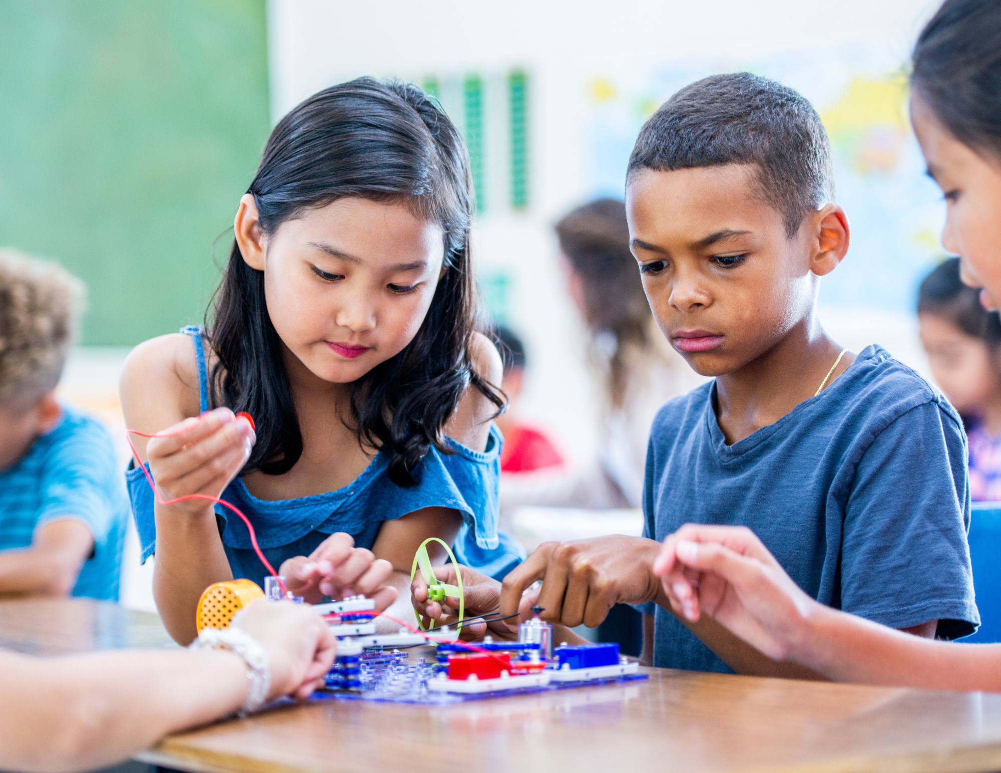 Children working together on a science project at school