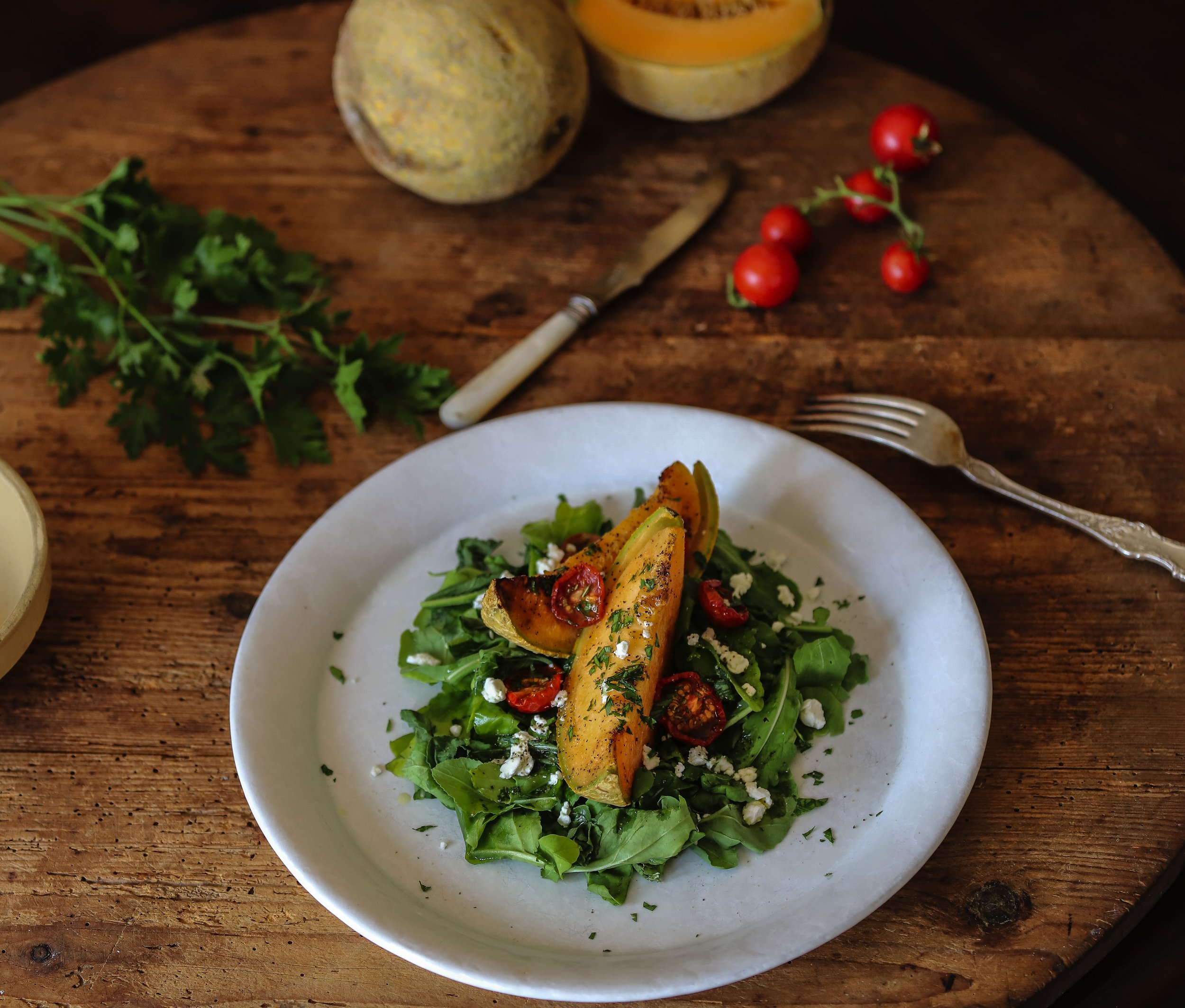 Arugula, Cantaloupe, Roasted Tomatoes, Parsley, and Goat Cheese Salad with a Lemon Vinaigrette
