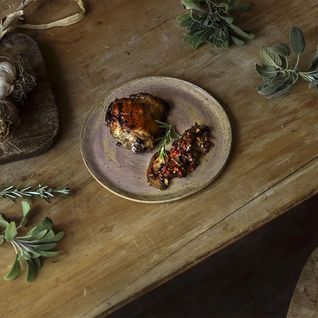 Chicken with Honey, Garlic, Rosemary, and Sage. Served with Sauteed Mushrooms, Chili Pepper, and Garlic
