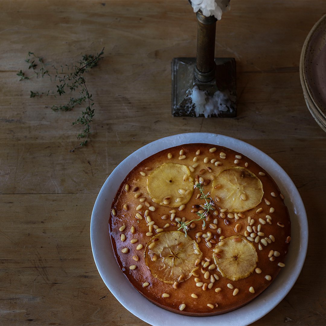 Apple, Sage Honey, and Ginger Olive Oil Cake with a Lemon Glaze and Pine Nuts