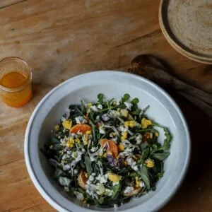 Fava Tendril Leaves, Wild Arugula, Page Mandarin, and Egg Salad with Goat Cheese and a Page Mandarin and Wildflower Honey Dressing