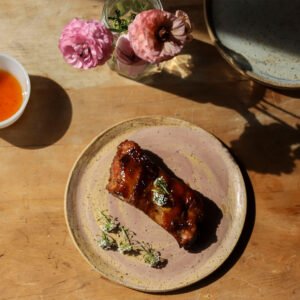 Baby Back Ribs with a Wildflower Honey and Raspberry Jalapeño Glaze and Sweet Alyssum
