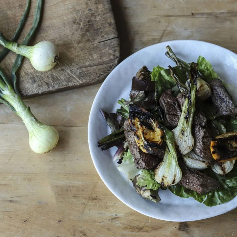 Warm Spring Onion, Artichoke, Meyer Lemon, and Coulotte Salad with a Sage Honey Dressing