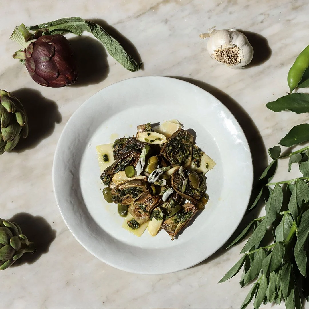 Slow Roasted Baby Artichokes with Fava Beans, Greens, Garlic, and Parmigiano-Reggiano