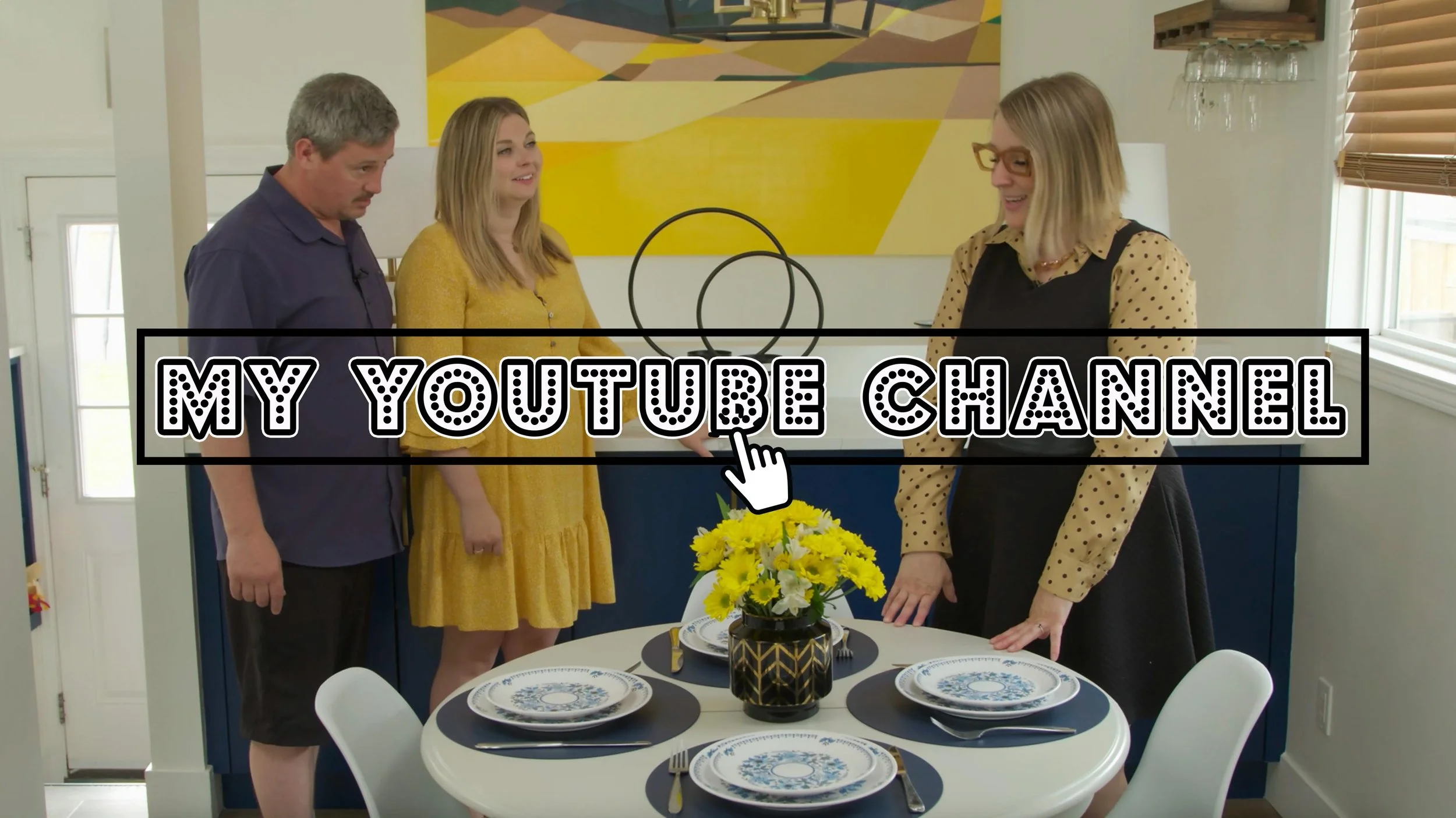 a nicely dressed girl stands in a freshly made over dining area with her clients, as shot as an hgtv-style pilot, walking them through the changes made to their space