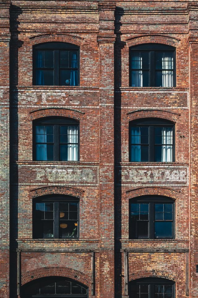 A block of flats converted from a red brick Victorian warehouse.