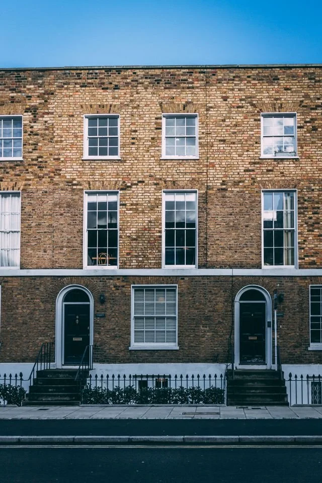 Pale brick terraced town houses in Islington, London.