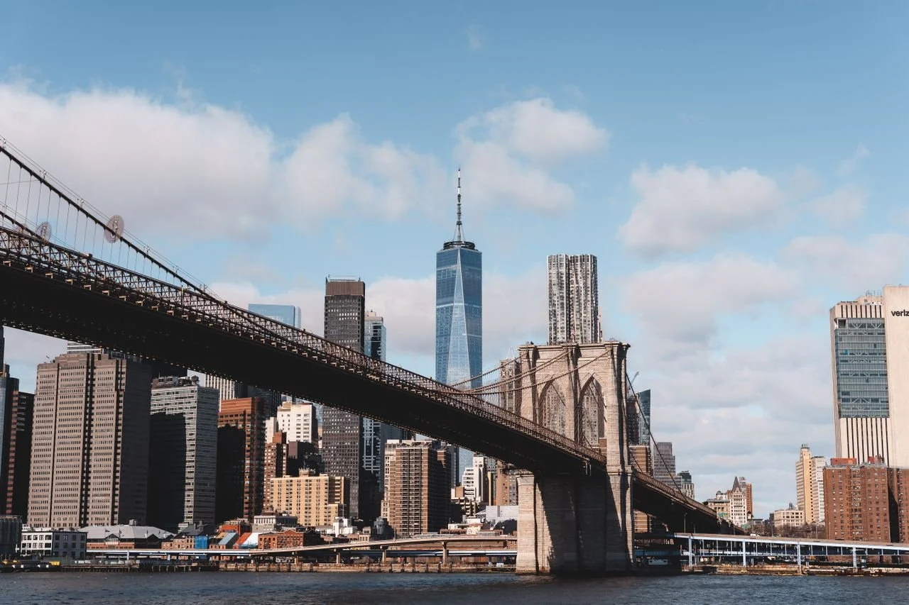 View of Brooklyn Bridge with Manhattan skyline in the background.