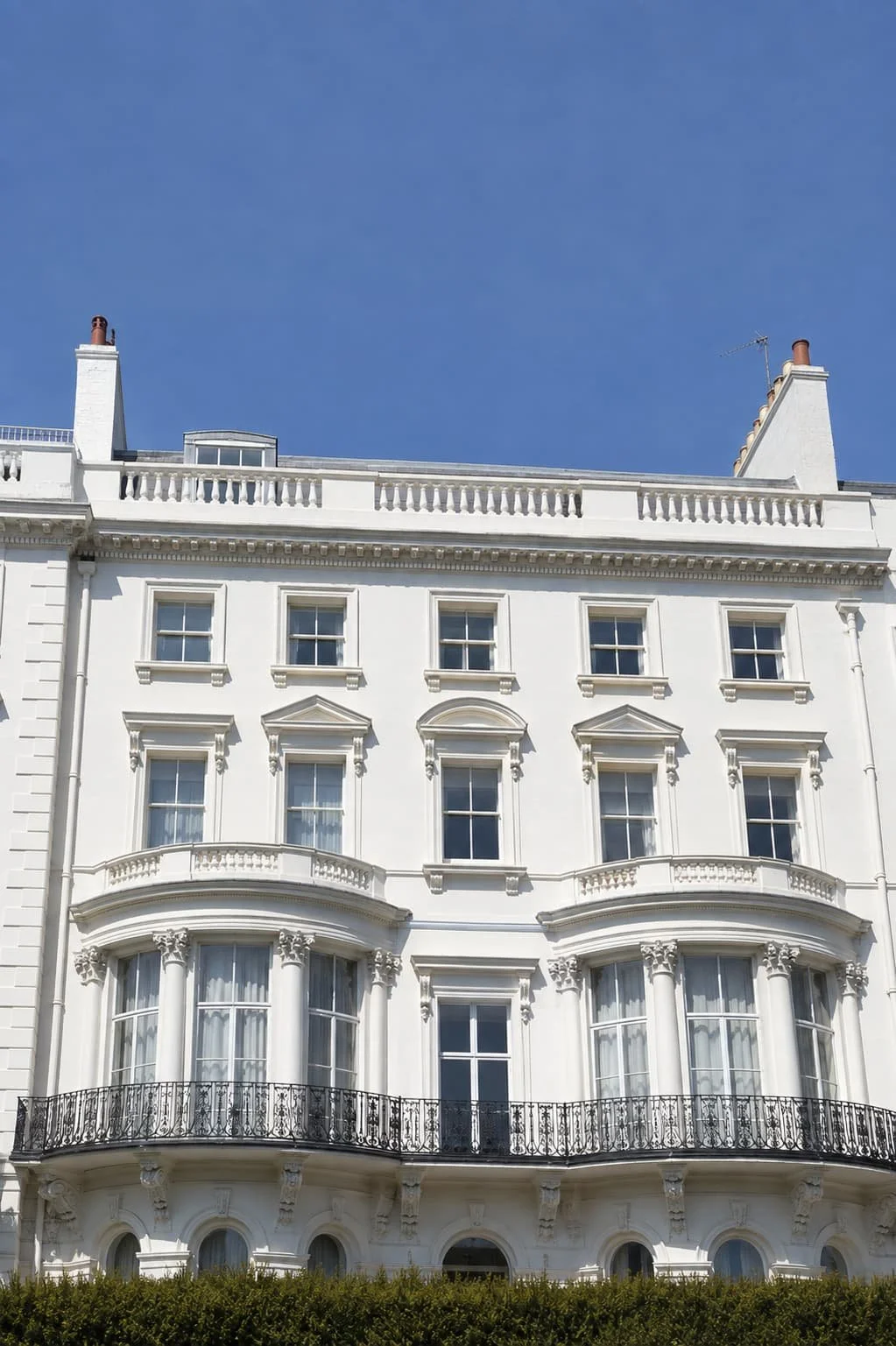 Large white terraced town houses, let as multi-unit freehold blocks.