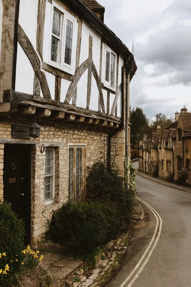 A tudor wooden beam house on a street corner in a quaint English town.