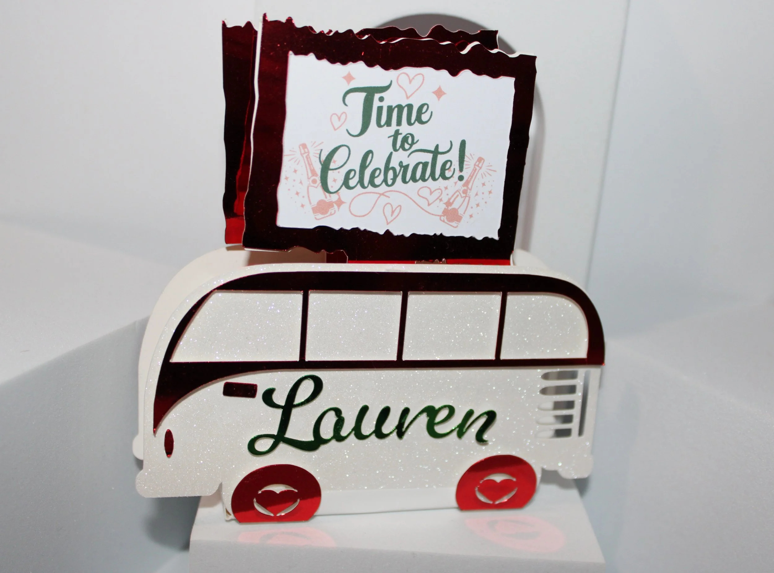 Above the campervan is a little signpost that reads "welcome to our wedding" on one side & on the other side "time to celebrate". These favour boxes can also act as a place setting as they will have the guests name placed across the campervan.