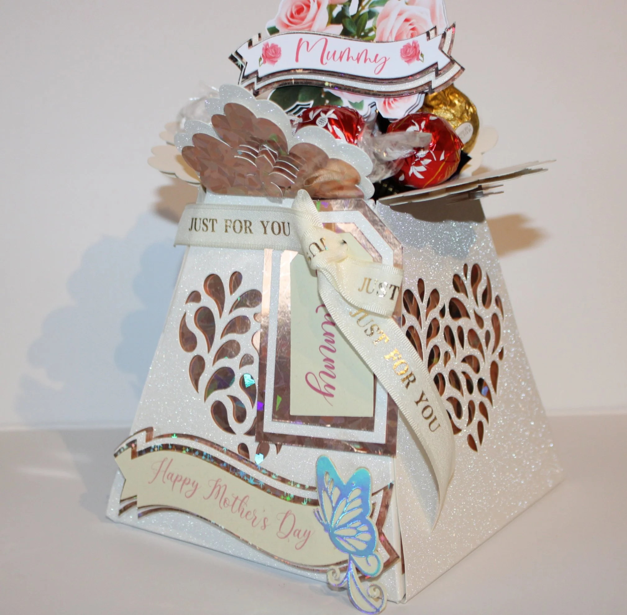 Cut from premium white glitter card for a soft, elegant sparkle, complemented by holographic card accents that add a subtle, eye-catching sheen. 