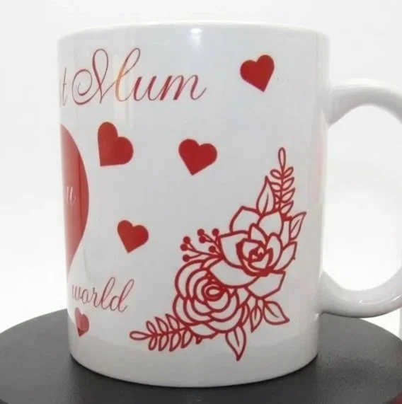 Floral motif printed on both sides of the heart, wrapping slightly around the mug.