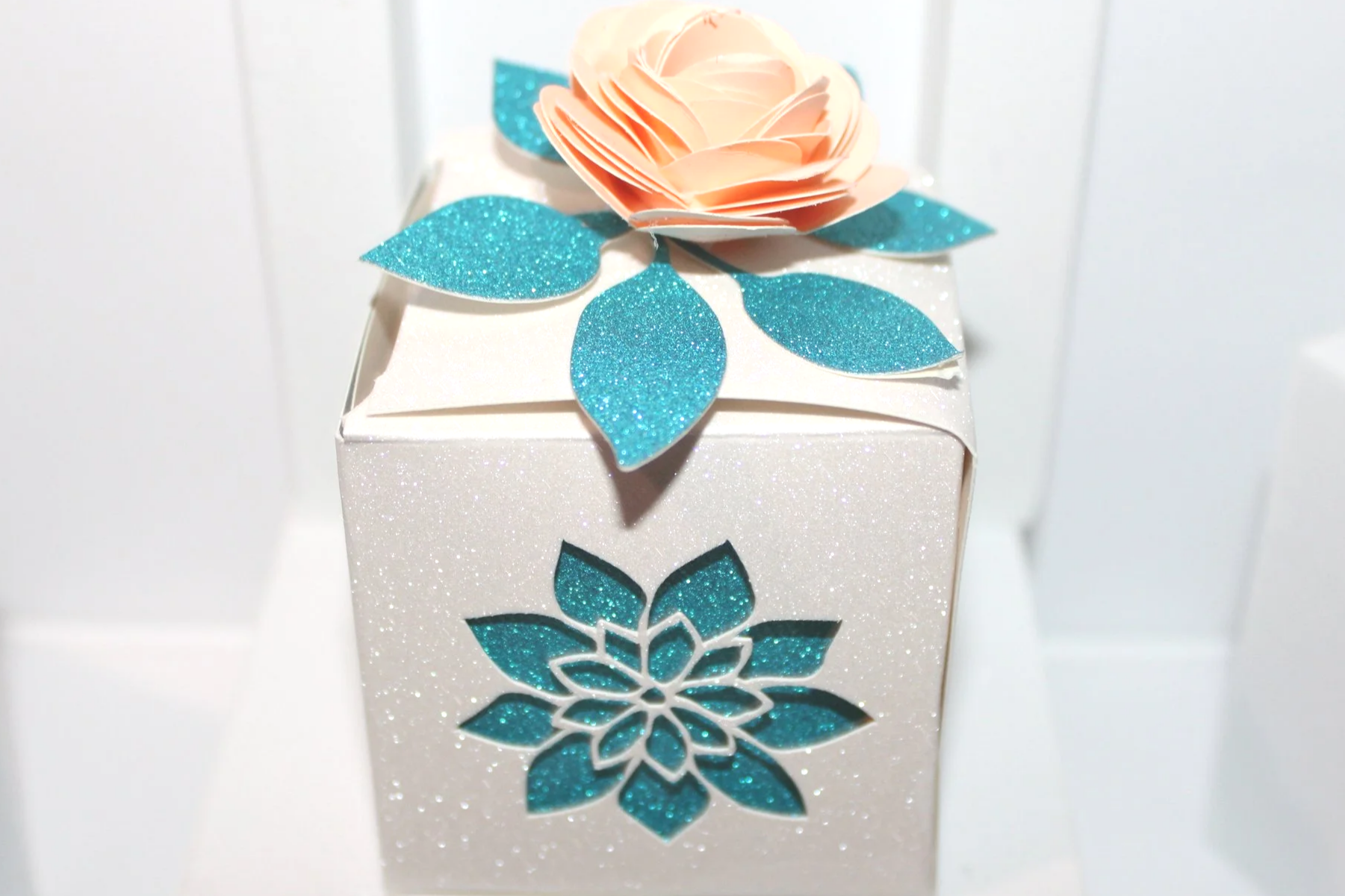 
Absolutely stunning! And that gorgeous orange rose on the lid? It’s like the cherry on top of a beautiful cake, right?

These boxes are not just pretty; they add a special touch that your guests will absolutely love. 
