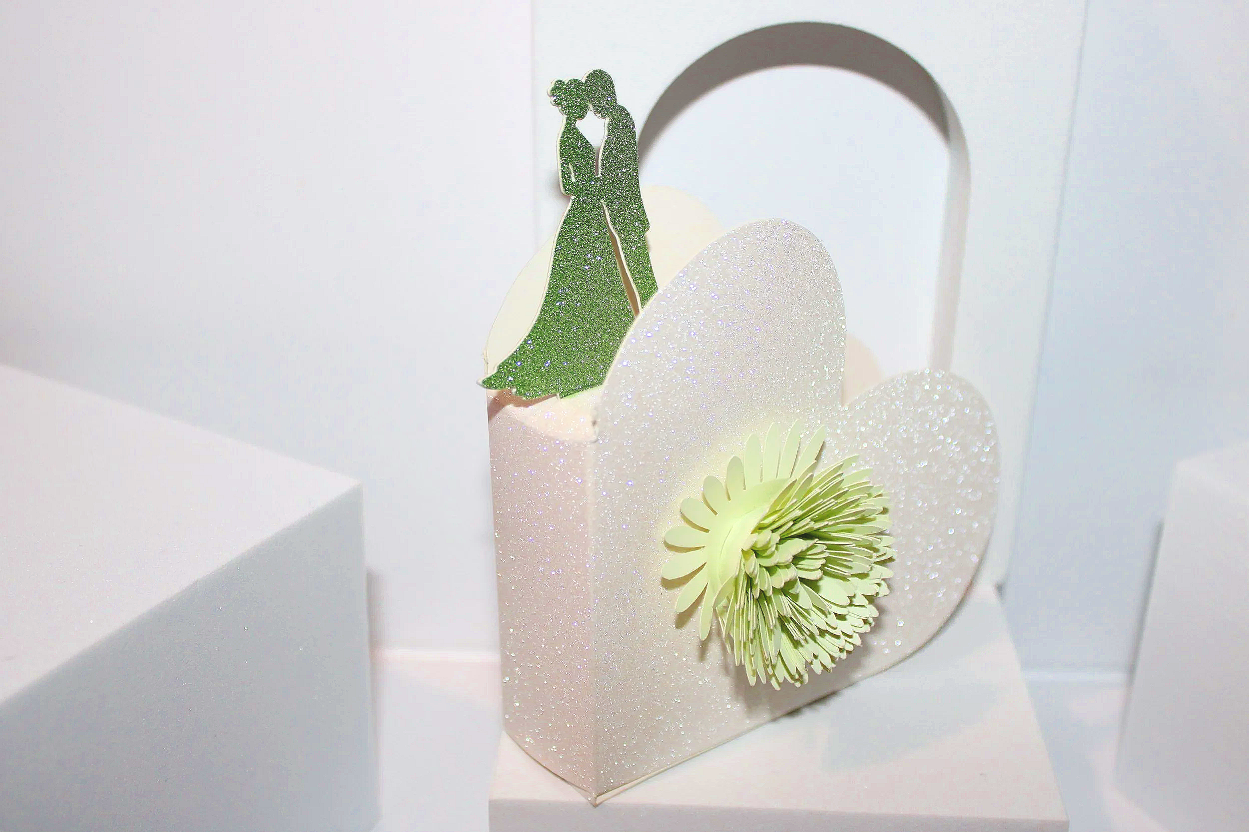 And check out the delicate flower cutout on the front! 

The main box is made from sparkling white glitter card, making it an absolute showstopper at any wedding.
