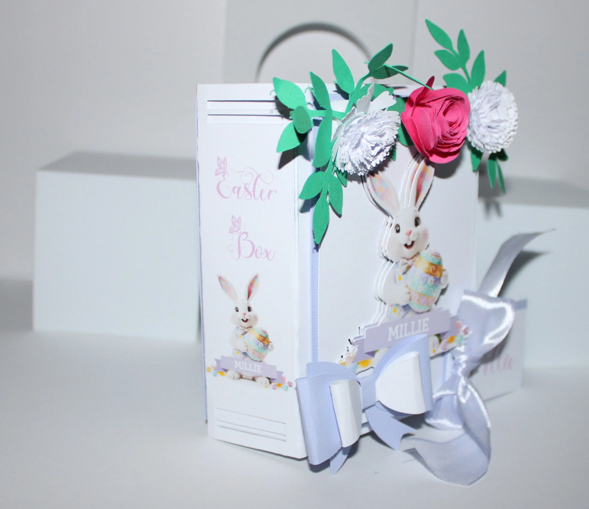 The spine is inscribed with "Happy Easter" alongside the recipient’s name, creating a keepsake-ready presentation that doubles as seasonal décor.