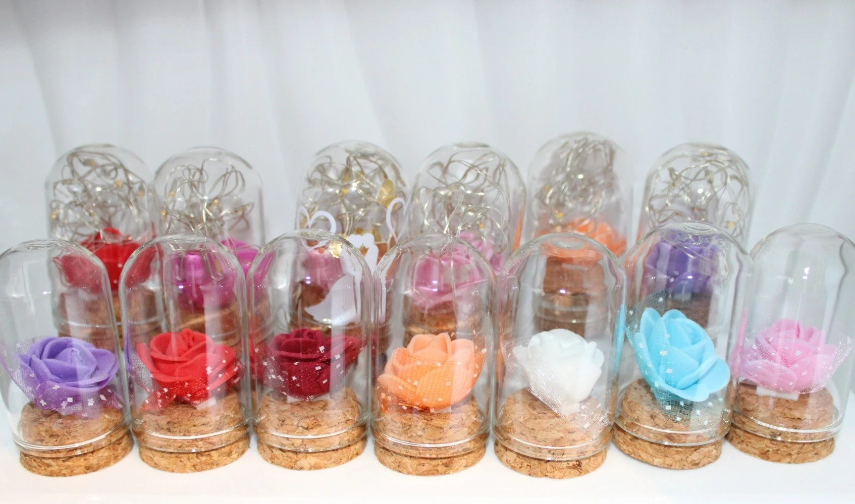 Glass Domes!
These adorable miniature glass domes feature a delicate rose encased in the dome.

 Illuminated by twinkling led lights, that bring a soft romantic glow. #00119

