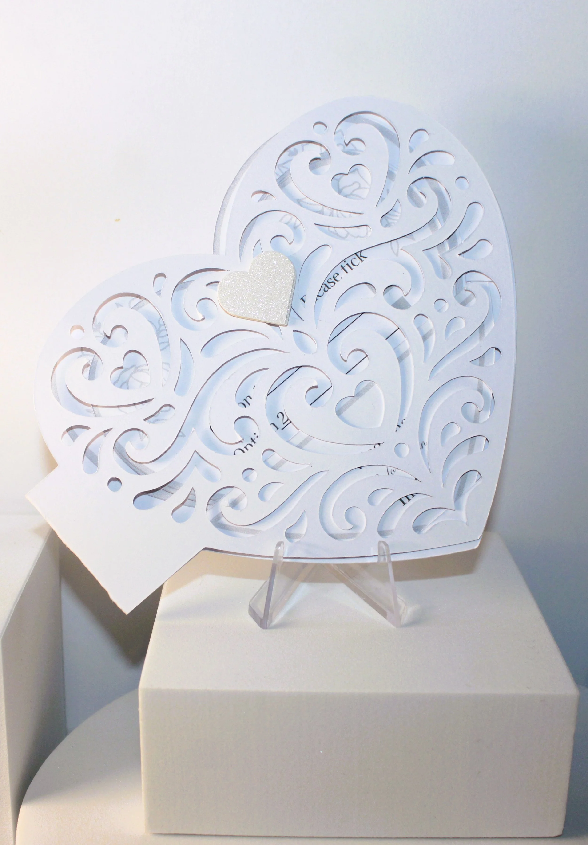 HEART INVITATION PACKAGE! A stunning piece of stationary that is unique, with it’s side opening & intricately cut swirls cut into the heart. The invitation has a small pouch inside that holds the inserts in place. #009