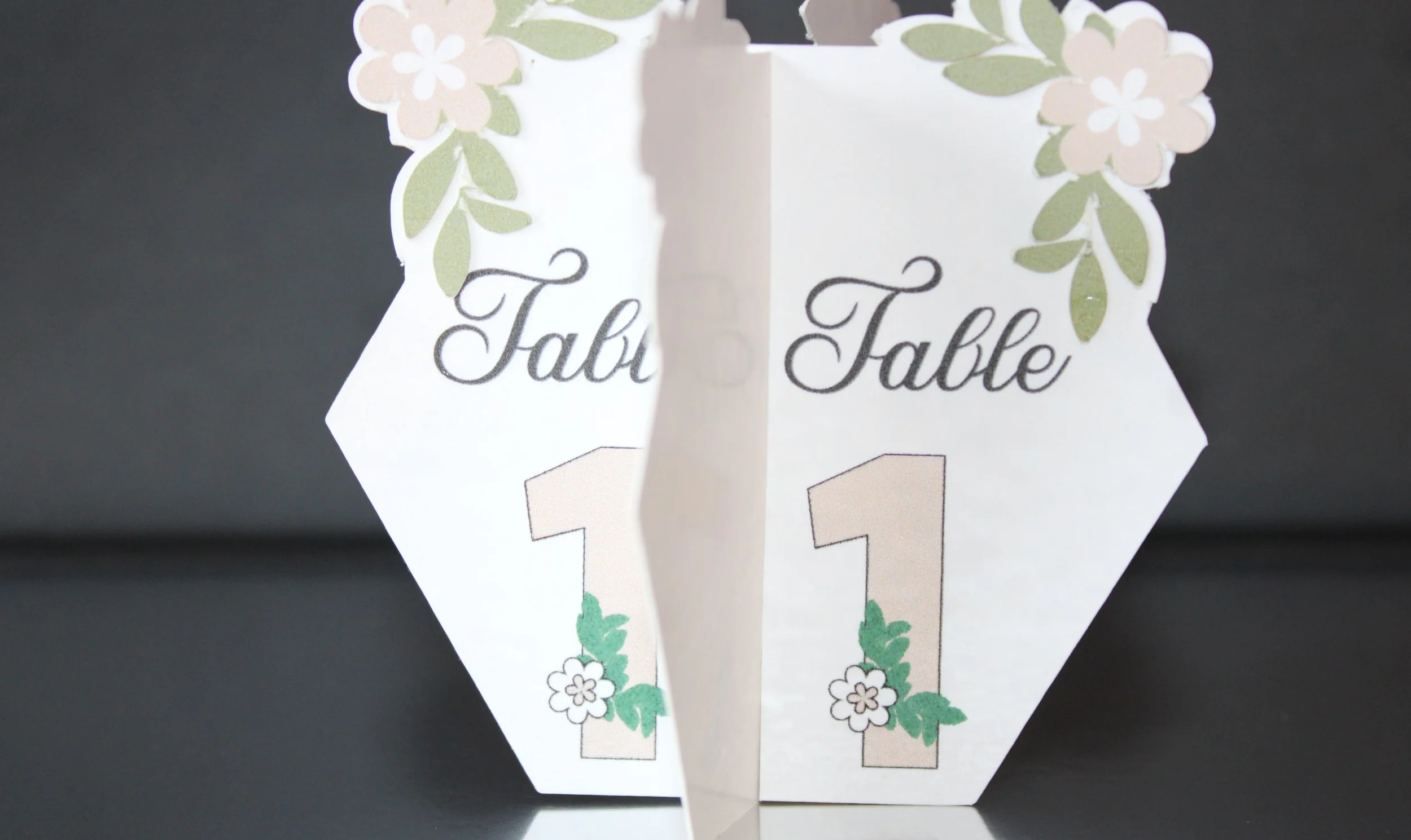 Hexagon floral table number!

This beauty features a gorgeous floral print that flows off the edges. It’s not just any table number, it’s a unique hexagon shape that slots together beautifully to form four elegant panels. #0054
