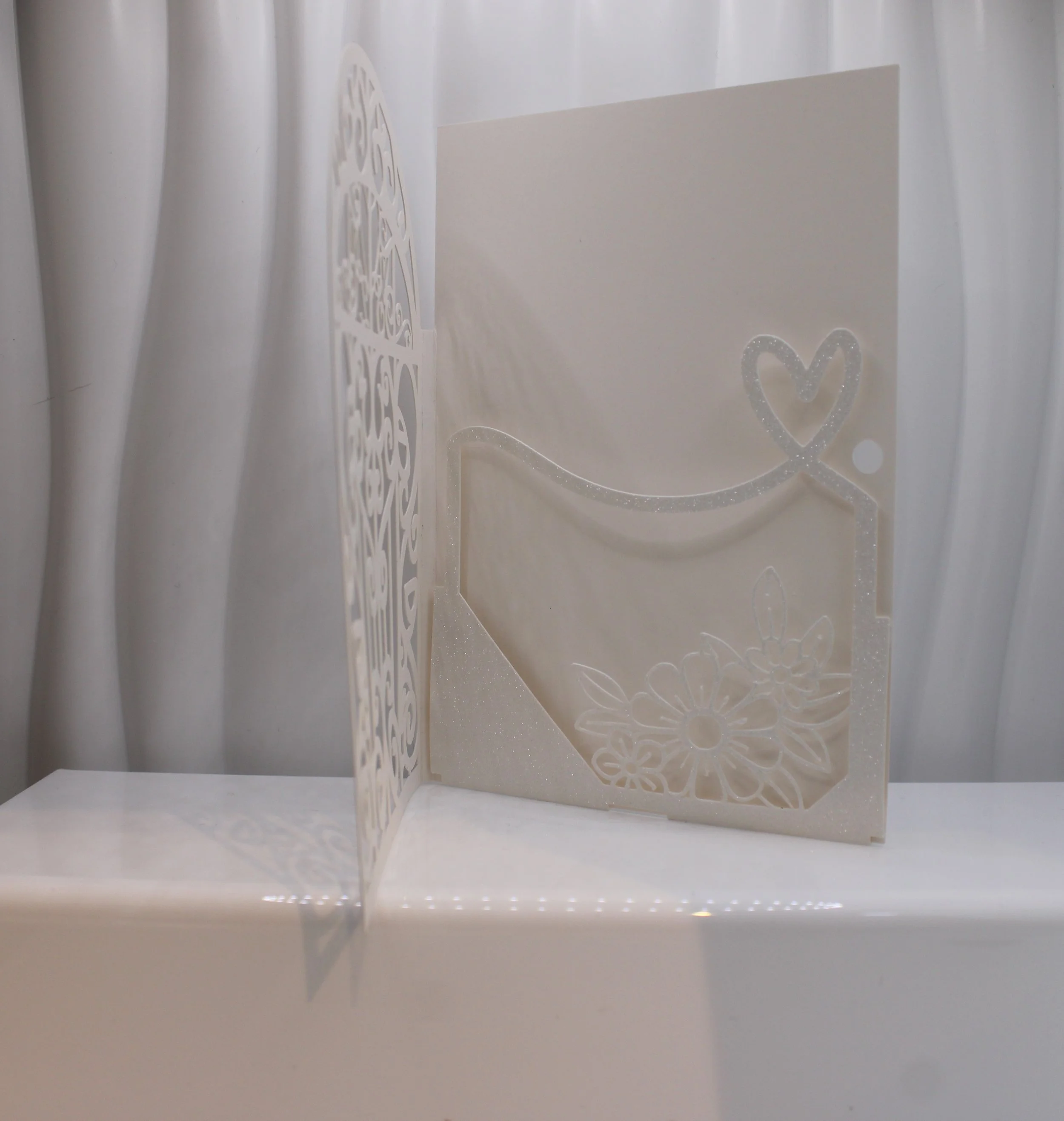 When the recipient opens their invitation they will find a stunning insert pouch that cradles all of your details. 