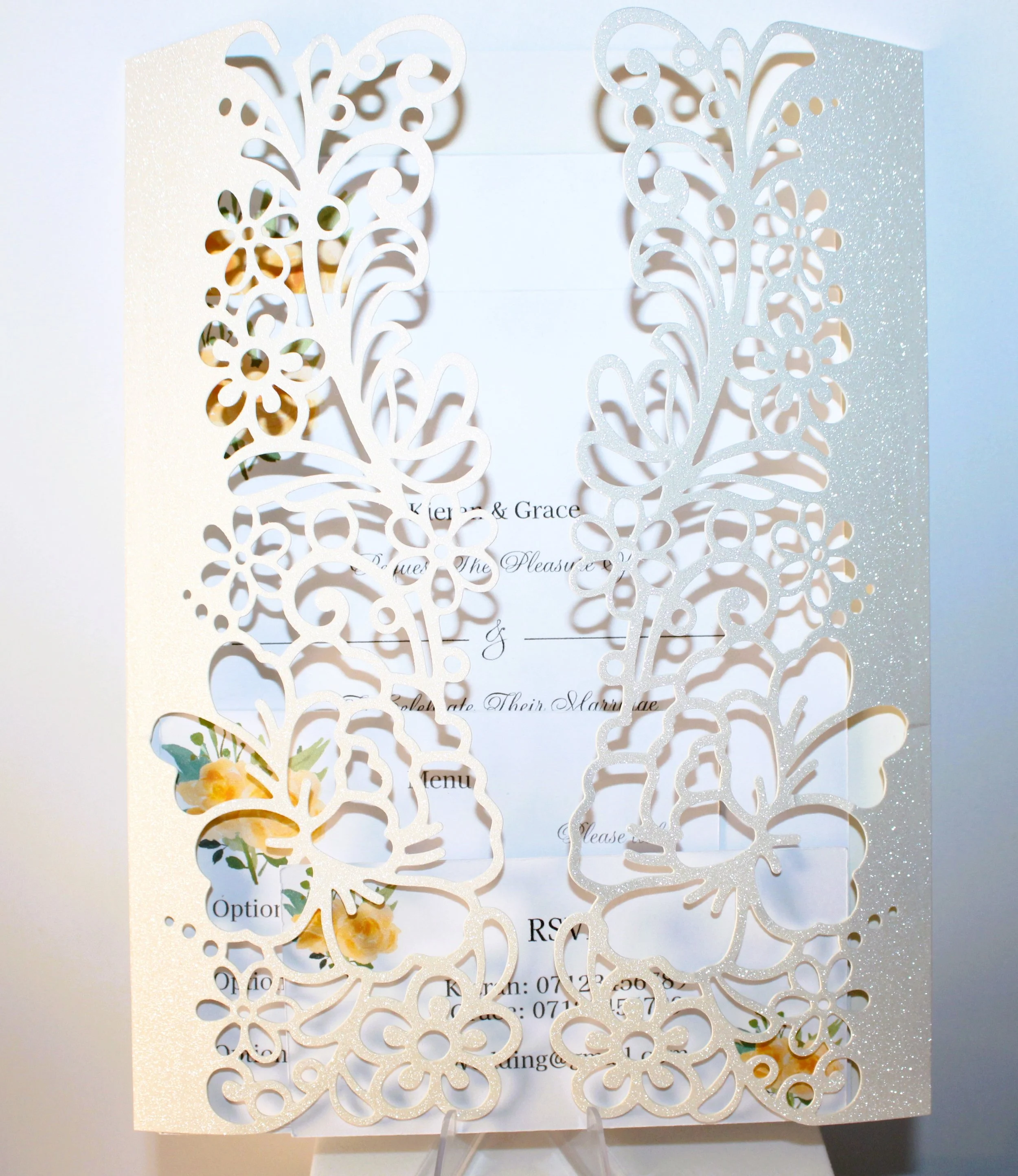 This isn’t just any invite; it’s a stunning white glitter card that sets the perfect tone for your celebration.