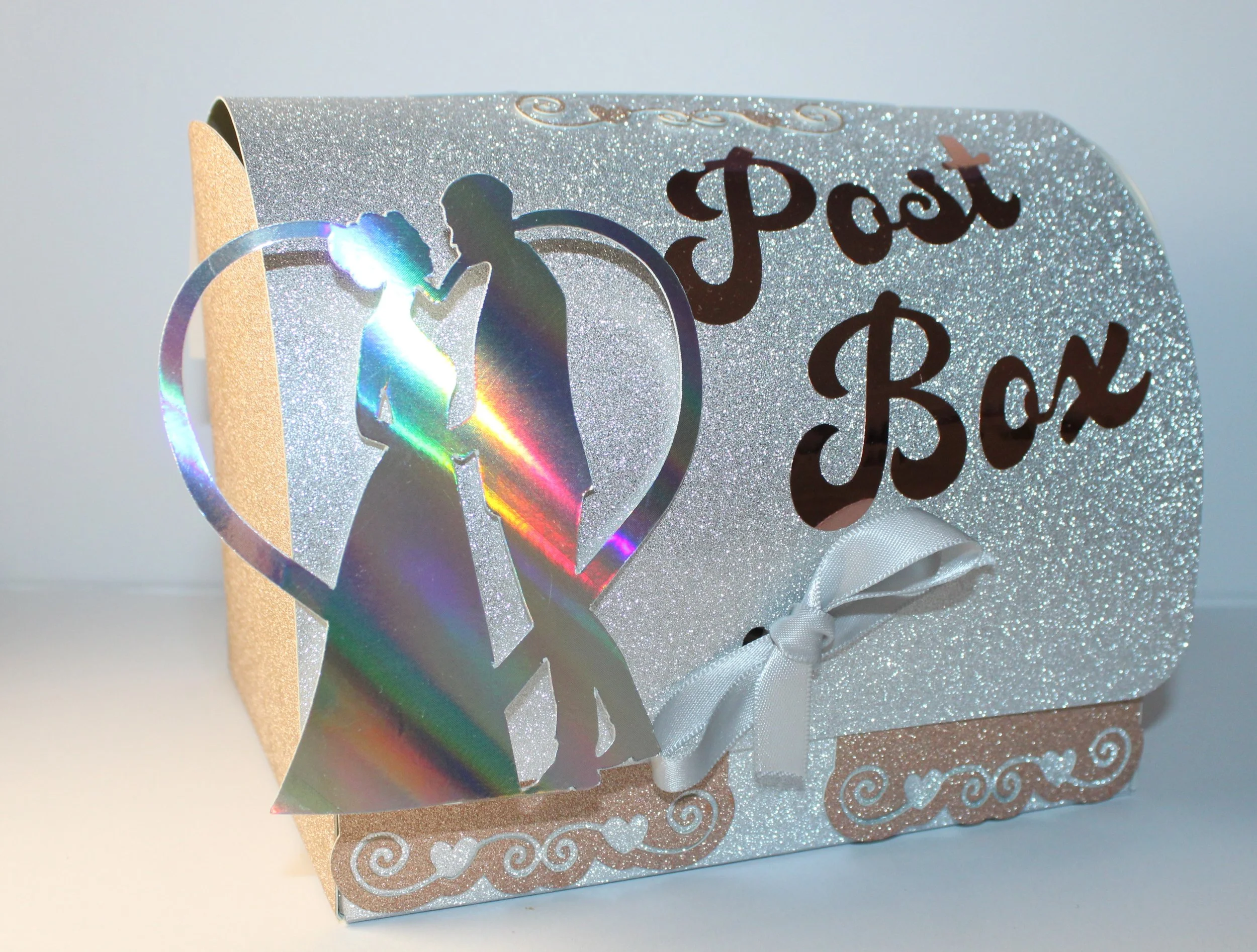 The box has a slot on the top to insert the messages. When your wedding day is over simply untie the ribbon, lift the lid & there you will find all your messages.