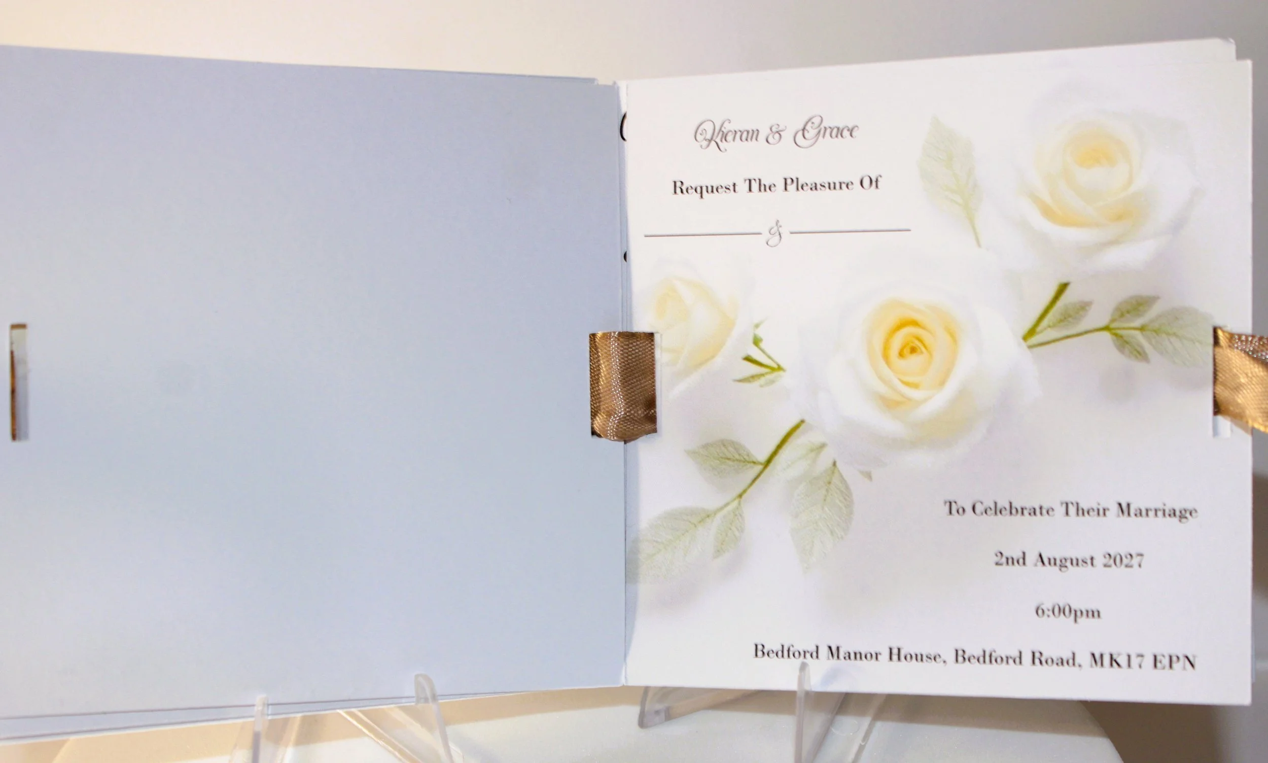 Each page holds all of your wedding information with the ribbon entwined through the book and then tied into a cute bow.