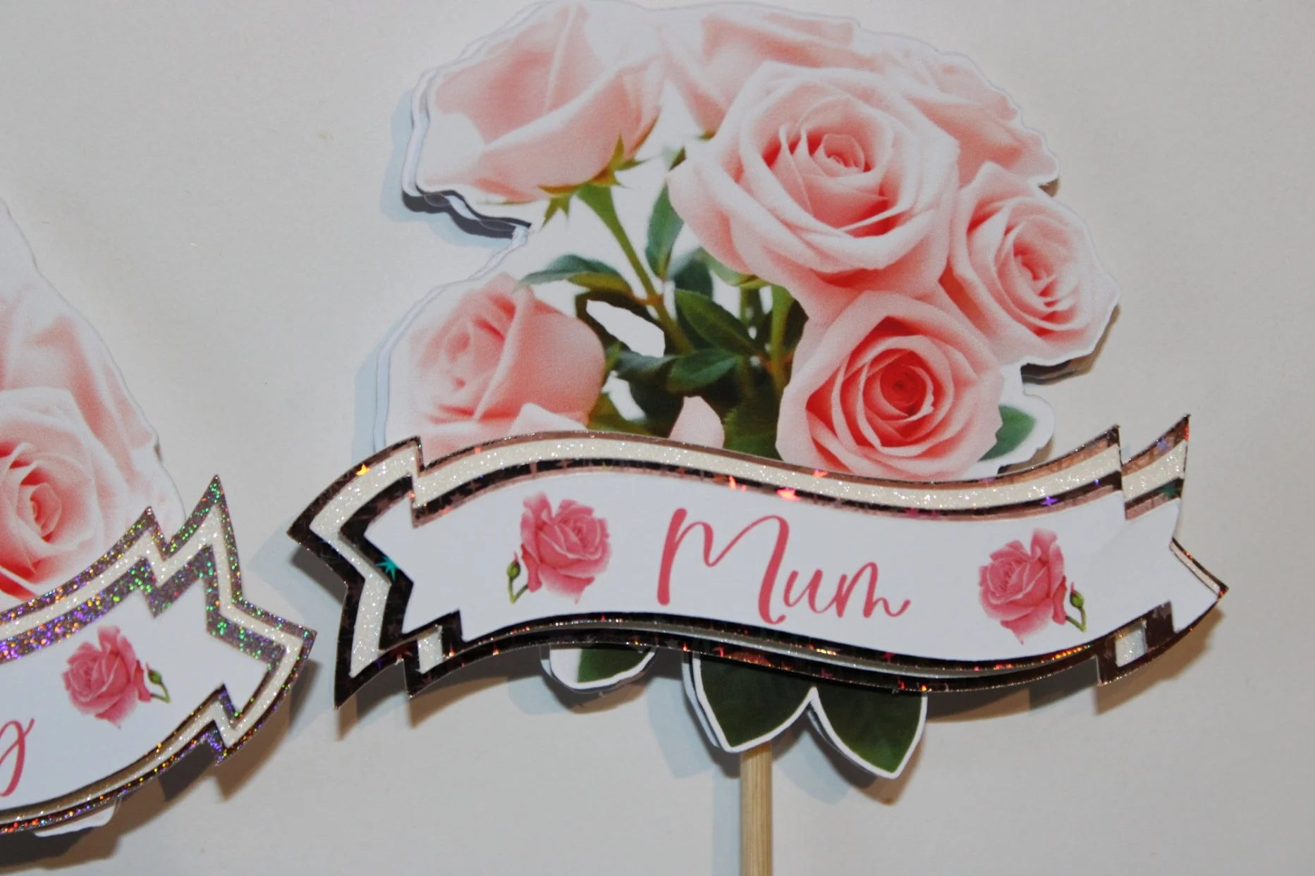 Mounted on sturdy wooden sticks for easy placement in bouquets or vases