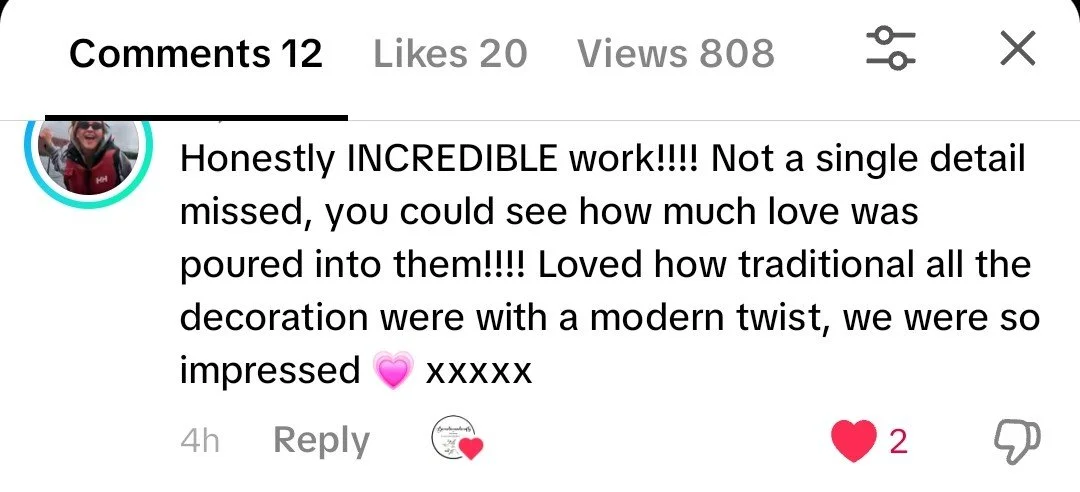 Screenshot of a social media comment praising a detailed, modern decorated cake with traditional elements.
