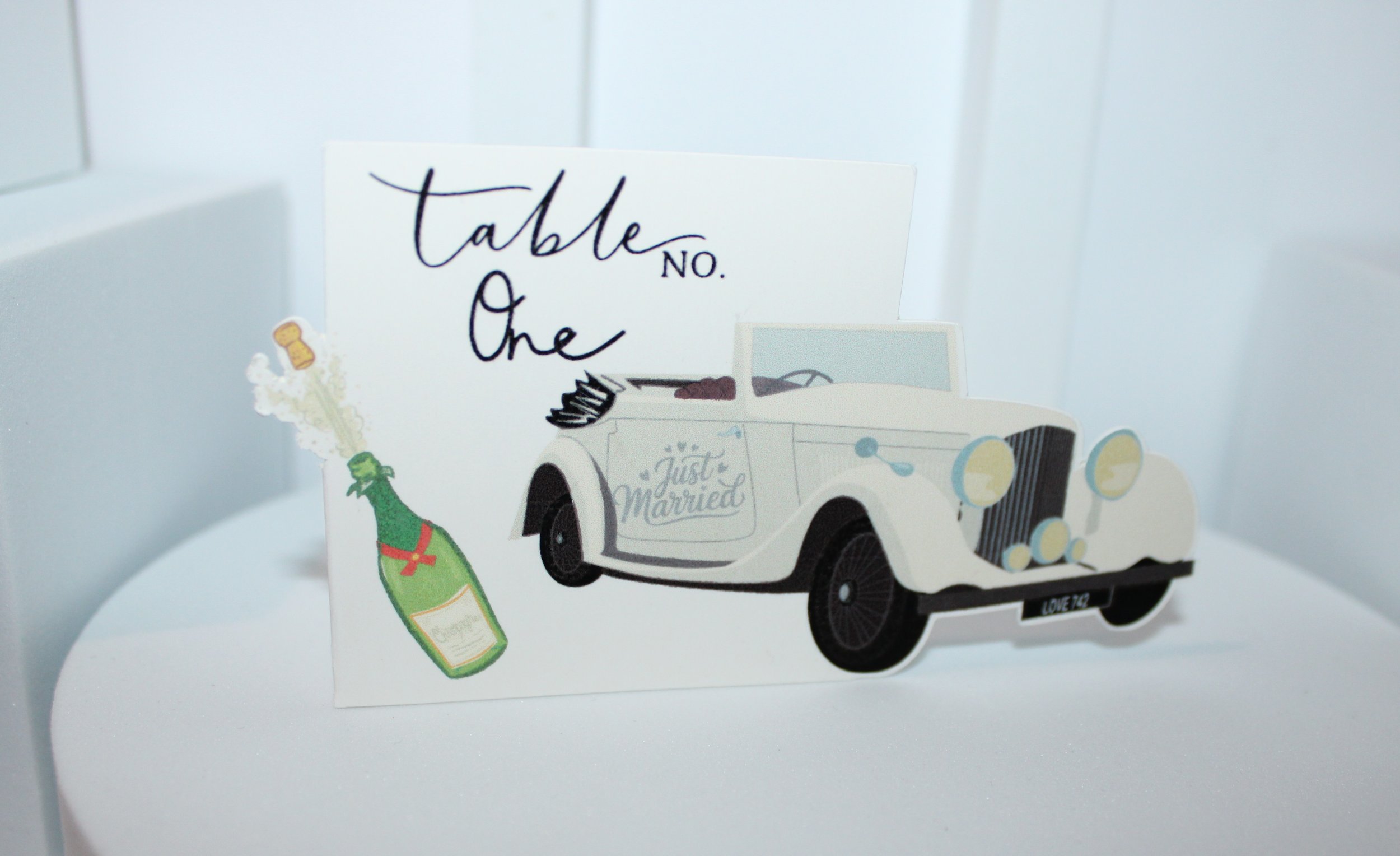 Vintage car table number!

The vintage car design extends beautifully off the edges, giving them a unique nostalgic feel. these truly are stunning cards. #0045