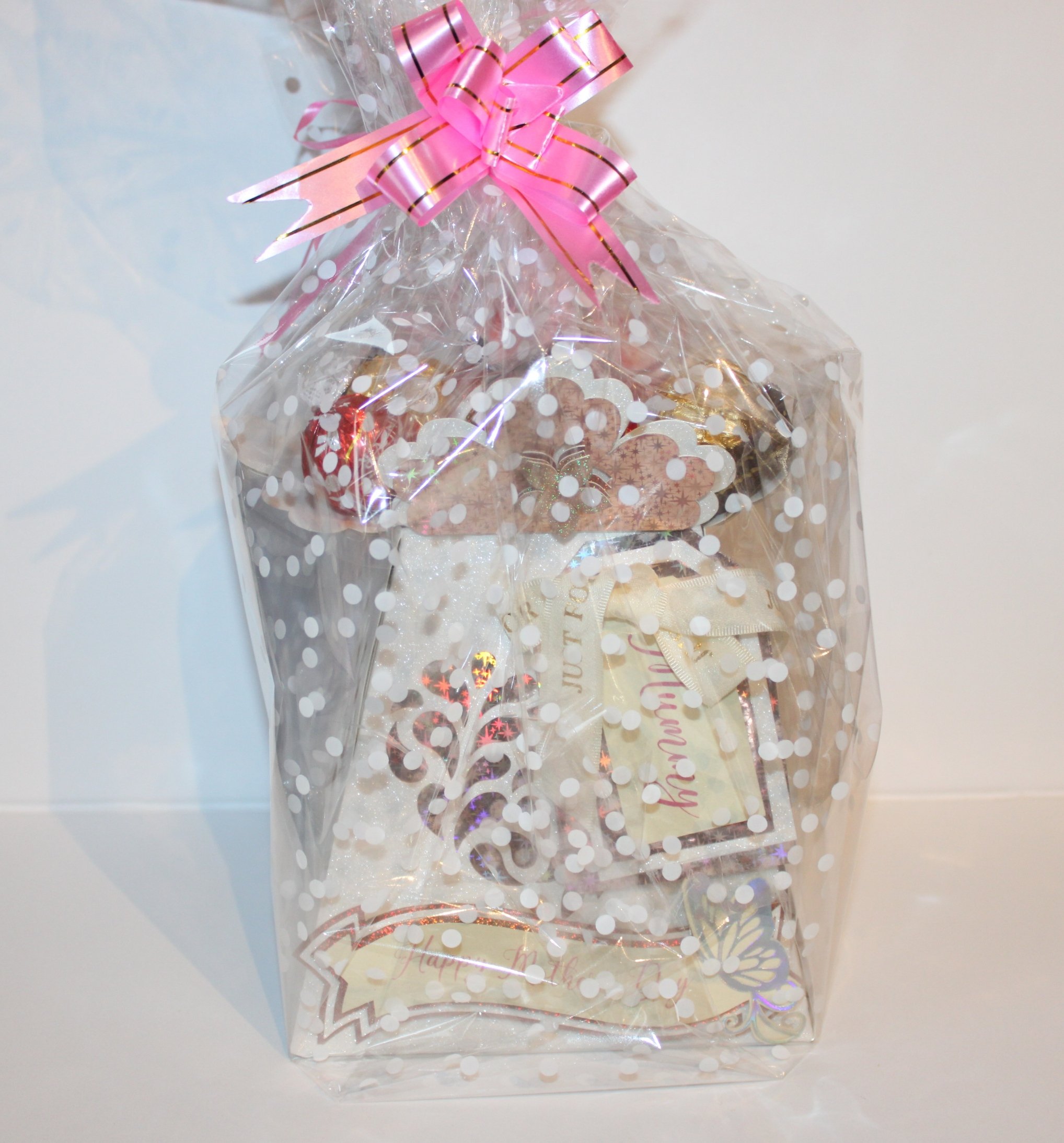 Carefully packaged in clear cellophane and wrapped with a pink bow. Customisation options available: Choice of sweets, name/text for the prop stick, and alternative banner wording on request.
