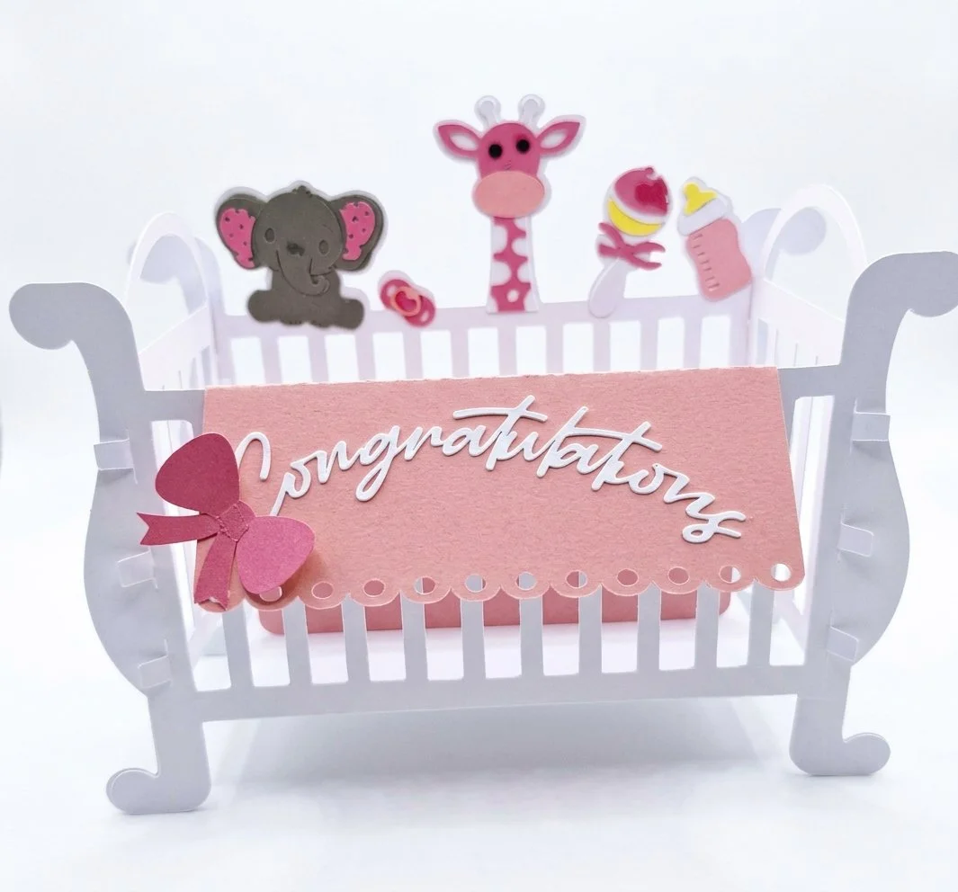 Delicate cot-shaped gift holder!
Cut entirely from premium card — the perfect keepsake for a new baby or baby shower. Designed to hold small gifts, confetti, sweets or favour tokens, this miniature cot combines charming detail with sturdy constructio