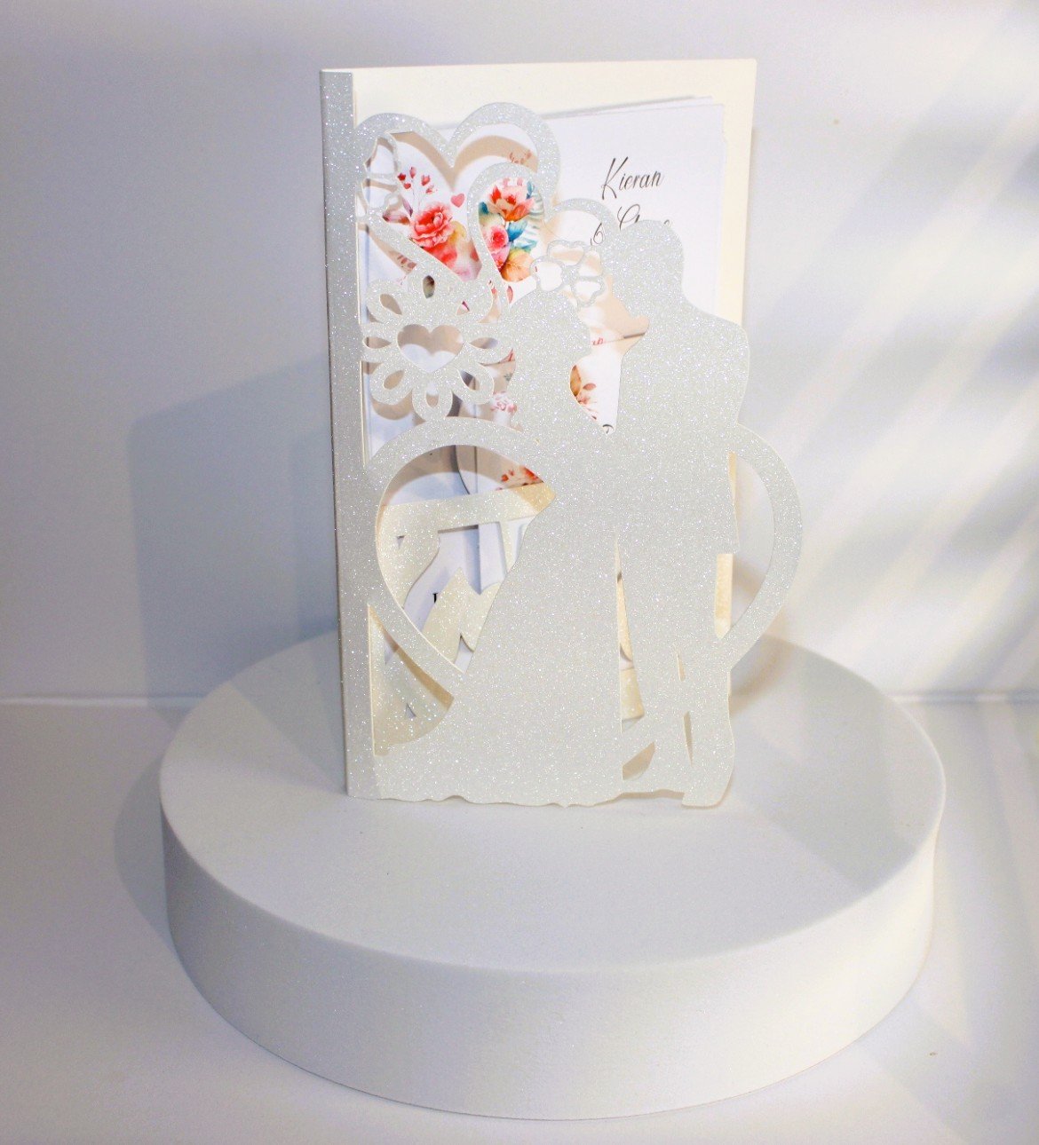 BRIDE & GROOM INVITATION PACKAGE! Introducing our exquisite invitation card with a intricately cut church to the front of the invitation. Adorned with shimmering white glitter and delicately cut hearts flowing off the church. #002