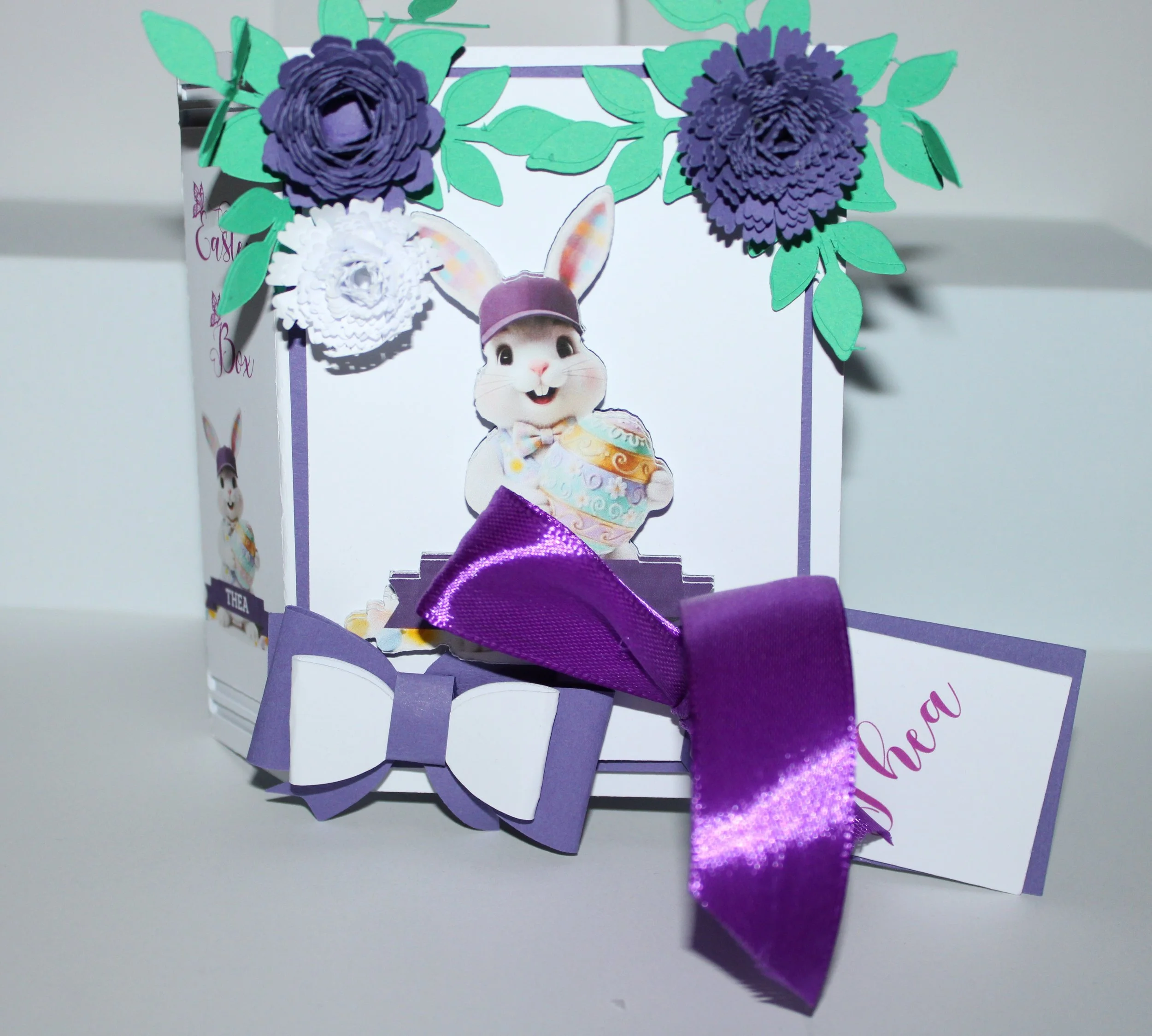 Easter Gift Box For Her! 
Easter gift box shaped like a book, handcrafted with care and charming details. The cover features an AI-generated bunny illustration, precision-cut and layered for a dimensional look.  #00173