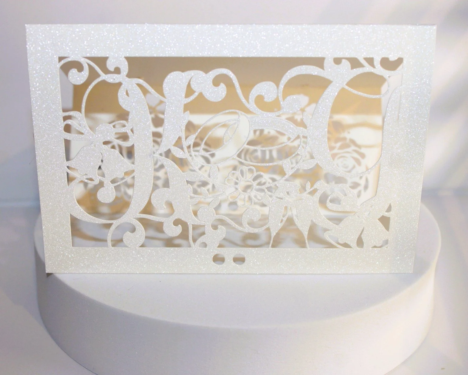 The design also has wedding rings and champagne flutes crafted into the card . this invitation will certainly catch the eye of your recipient. 