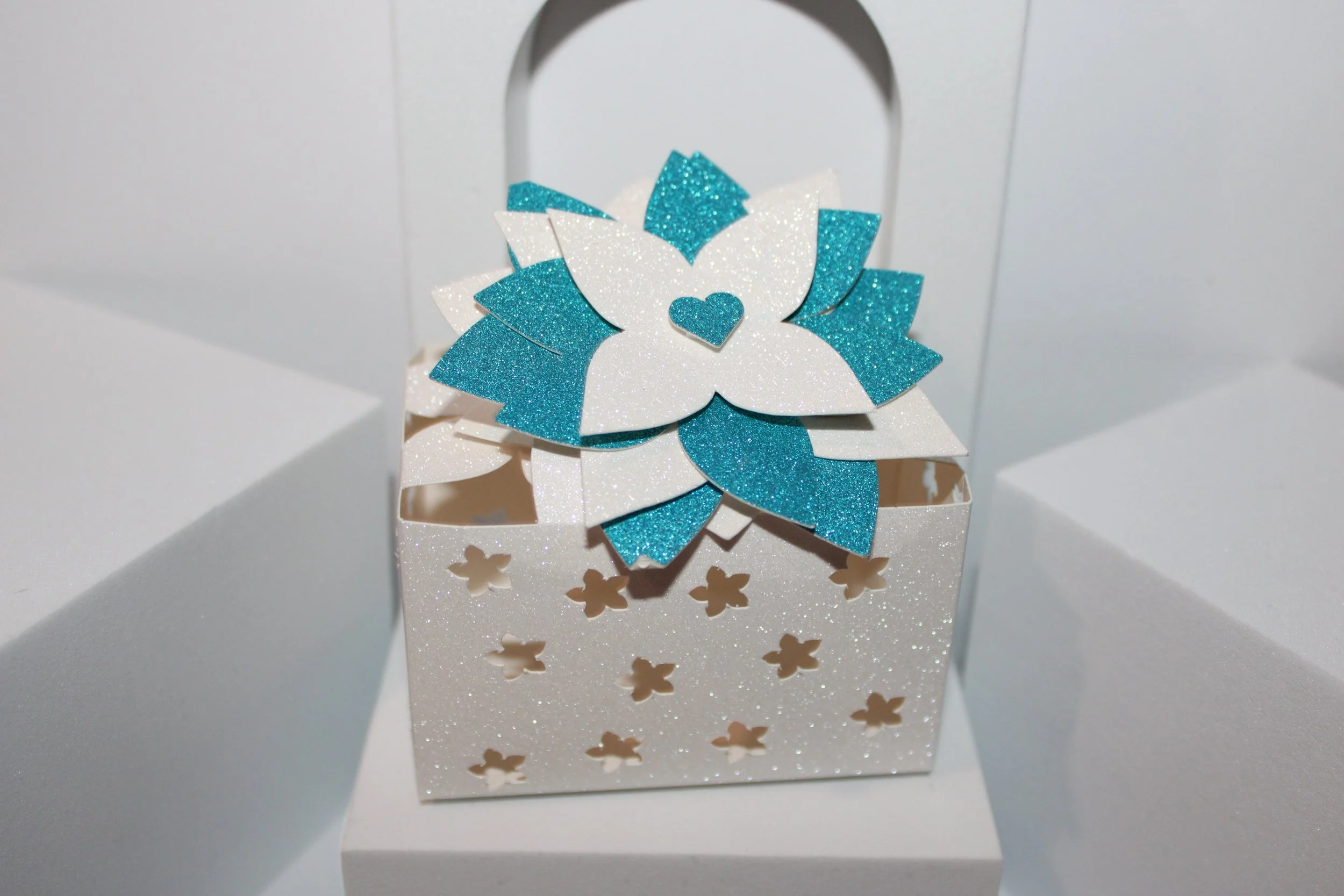 In addition there is also a large flower that acts as a closing. crafted in white & blue glitter card, this box really is beautiful.