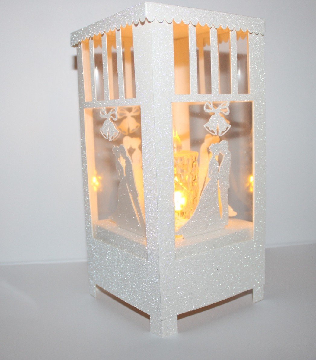 It's a beautiful way to honor your love story.

 A clear window encircles the lantern, allowing candle light to shine through. 