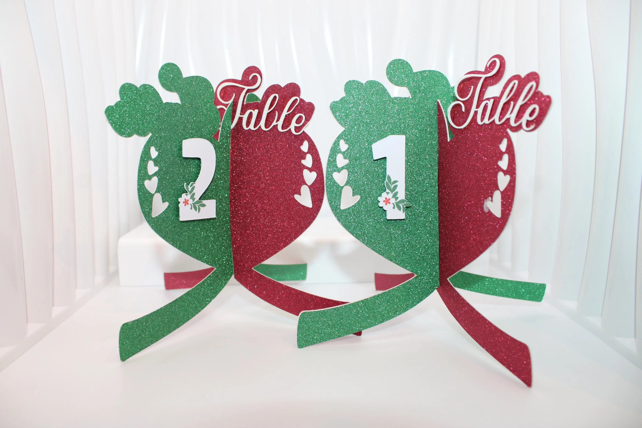 Four panel heart table number!

Imagine a wedding that just screams love. check out these heart shaped table numbers, they are an absolute must have for your special day. The font extends beautifully onto the edge of the heart. #00127