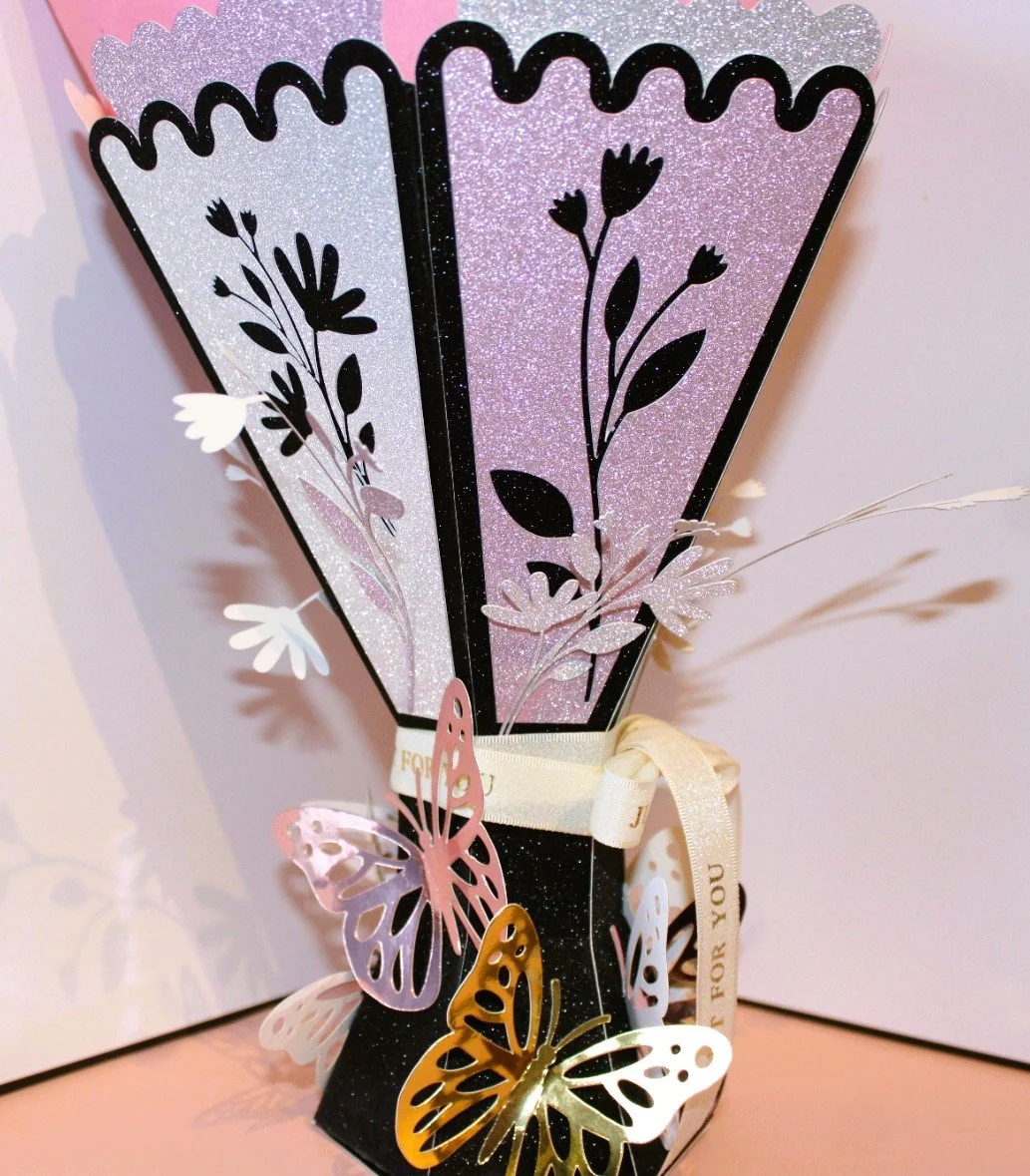 Flowers & butterflies adorn the vase. This really is a unique vase. 